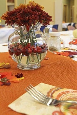 The tables are decorated and set for the Nov. 22 Jesse B. Denney Tower Thanksgiving dinner at the low-rise building for senior residents in Athens. This year marked the 20th annual dinner prepared and served by volunteers from the University of Georgia Catholic Center. Photo By Michael Alexander