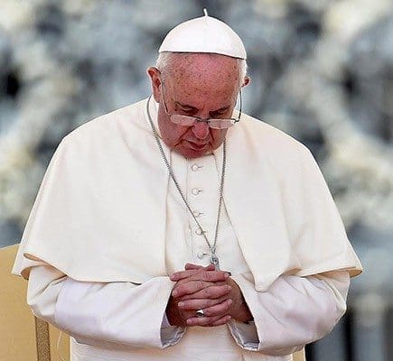 Pope Francis prays during his Aug. 26 general audience in St. Peter's Square at the Vatican. Pope Francis says he wants the Year of Mercy to usher in a "revolution of tenderness." CNS photo/Ettore Ferrari, EPA