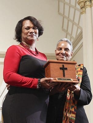 Luella Chambers, right, presents the Father Bruce Wilkinson Founders Award to Mary Jane Cooper of Our Lady of Lourdes Church, Atlanta. Chambers was subsequently awarded the Charles O. Prejean Sr. Unity Award. Photo By Michael Alexander