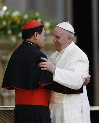 Pope Francis embraces Mexico City Cardinal Norberto Rivera Carrera during a meeting with Mexico's bishops in the cathedral in Mexico City Feb. 13. CNS photo/Paul Haring