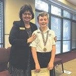 The first-place winner of the 2016 Archdiocesan Spelling Bee is fifth-grader Roscoe Hutchinson, of St. Jude the Apostle School, Sandy Springs. The spelling bee is held each year during Catholic Schools Week. Roscoe is shown with Dr. Diane Starkovich, archdiocesan superintendent of Catholic schools. 