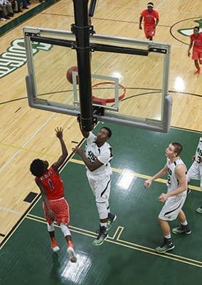 Holy Spirit sophomore forward Nicholas Maddox banks two of his 13 points off the glass in the third period of the Feb. 24 Class AAA state basketball playoff game. Maddox helped lead his team to a 70-47 victory over the Westwood School of Camilla. Photo By Michael Alexander