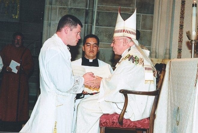 Father Joseph Peek, left, was ordained by the late Archbishop John F. Donoghue on June 22, 2002. Photo By Michael Alexander 