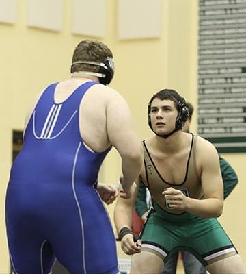 Pinecrest Academy senior Gabe Underwood, facing camera, wrestled at the highest weight class of 285 pounds against competitors who were 40-70 pounds heavier in order to fill that void for the team. Photo By Michael Alexander