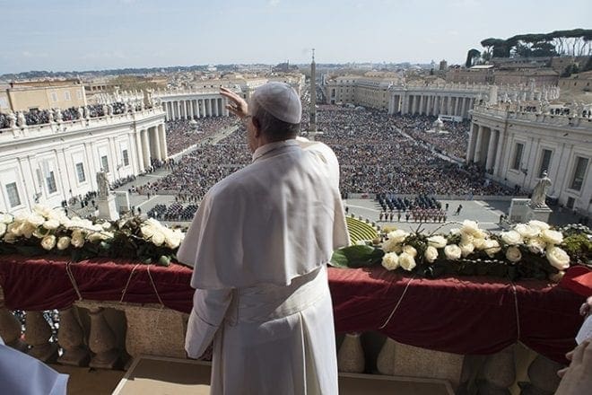 Pope Francis greets the crowd during his Easter message and blessing "urbi et orbi" (to the city and the world) delivered from the central balcony of St. Peter's Basilica at the Vatican March 27. CNS Photo/L'Osservatore Romano, Handout