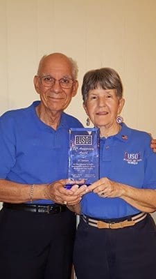 Jack and Pat Horvath of Corpus Christi Church, Stone Mountain, display an award given to Corpus Christi Church Seniors for their volunteer work with the USO at the Atlanta airport.
