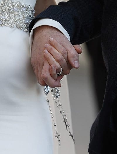 A newly married couple hold rosaries in their hands as they leave Pope Francis' general audience in St. Peter's Square at the Vatican Feb. 24. Pope Francis' postsynodal apostolic exhortation on the family, "Amoris Laetitia" ("The Joy of Love"), was released April 8. The exhortation is the concluding document of the 2014 and 2015 synods of bishops on the family. CNS Photo/Paul Haring