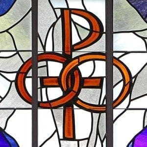 A pair of wedding bands symbolizing the sacrament of marriage is depicted in a stained-glass window at St. Patrick Church in Smithtown, N.Y. Pope Francis' postsynodal apostolic exhortation on the family, "Amoris Laetitia" ("The Joy of Love"), was released April 8. CNS photo/Gregory A. Shemitz 