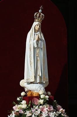 The original statue of Our Lady of Fatima is seen before Pope Francis celebrates Mass in honor of Mary in St. Peter's Square at the Vatican Oct. 13. The pope entrusted the world to Mary at the end of the Mass. CNS photo/Paul Haring