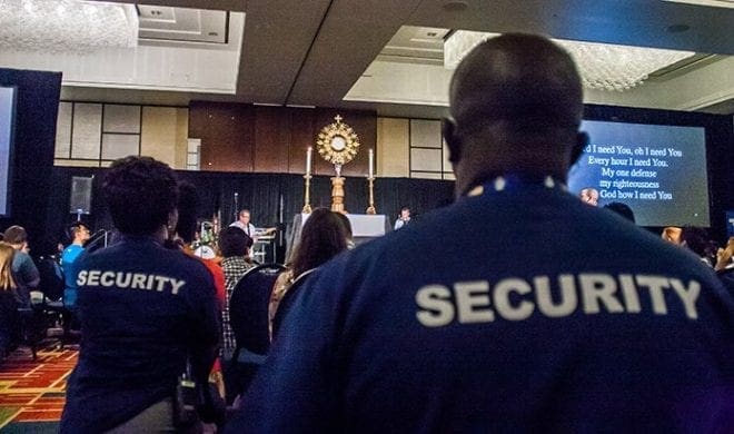 The close of the REVIVE session included time in prayer and adoration before the Blessed Sacrament. Eucharistic Congress security people were on hand as a precaution at the Marriott Gateway Hotel, where the track was held. Photo By Thomas Spink