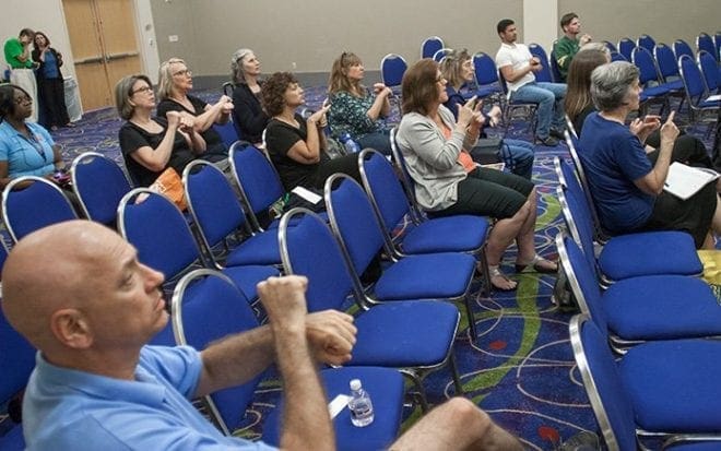 Attendees at the ASL track at the congress sign during the session. Some 40 people from the local deaf/hard of hearing community in the Atlanta area came to learn and share about the deaf culture and the Year of Mercy. Photo By Thomas Spink