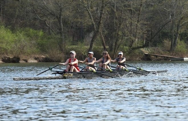 Varsity women’s team participants (l-r) Kenzie Fisher, a junior at Riverwood High School, Atlanta, Laura Nelson, a sophomore at Centennial High School, Roswell, Isabel Castro, a freshman at South Forsyth High School, Cumming, and Madison Barber, a senior at the Westminster School, Atlanta, row on the Chattahoochee River in Roswell. In their quad shell (four rowers and no coxswain) they are displaying a type of rowing called sculling (each rower uses two oars). Photo By Michael Alexander