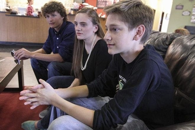 (Foregound to background) David Boudreaux, Lizzie Laegen and Karston Hopson were three of the high school thespians that performed in a skit surrounding the theme, “How to keep your light lit,” during the May 1 EPIC. Photo By Michael Alexander