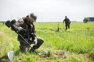 Members of Poland's 6th Airborne Brigade based in Krakow, Poland, search an area with metal detectors July 1 where the main celebrations of World Youth Day will be held near Wieliczka. Young people attending World Youth Day 2016 in Krakow will have to walk 18 miles to and from one of the key sites, event organizers said.
