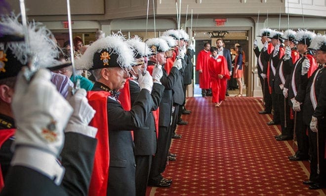 The Knights of Columbus of St. Brigid serve as honor guards for the parish’s April 16 confirmation Mass for young people with disabilities as the candidates process into the sanctuary. Five students received the sacrament of confirmation administered by Bishop David P. Talley. Photo By Thomas Spink