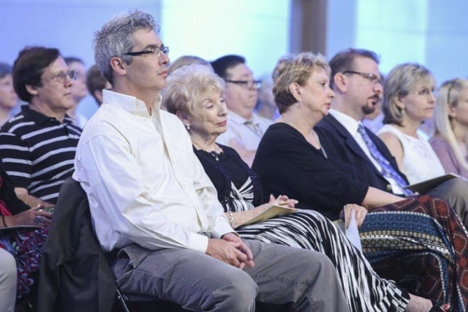 Abbot-elect Augustine Myslinski’s relatives listen to Archbishop Wilton D. Gregory’s homily. Sitting in the front row, they include (l-r) his cousin Rich Flynn of Chicago, his mother Connie Myslinski of Suwanee, his sister Mary Jo Taylor of Suwanee, and his brother and sister-in-law, Michael and Joni Myslinski of Johns Creek. Photo By Michael Alexander