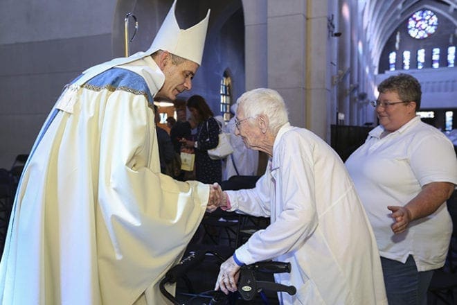 At the conclusion of the abbatial blessing the new abbot Dom Augustine Myslinski, OCSO, took the time to greet well-wishers like 88-year-old Rosemary Gibson and her daughter Missy of Smyrna. Both Gibsons are friends of the Monastery of the Holy Spirit, Conyers. Photo By Michael Alexander