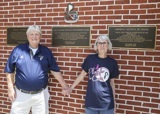 Tom Novack, 77, and his wife Joanne, 79, stand by the plaque that marked the naming of the concession stand in their honor in September 2004. The Novacks, who celebrate their 50th wedding anniversary Sept. 24, attend Immaculate Heart of Mary Church, Atlanta. Photo By Michael Alexander