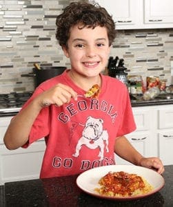 Jackson Kelly, a fourth-grader at St. Jude the Apostle School, Sandy Springs, is the Georgia winner of First Lady Michelle Obama's fifth annual Healthy Lunchtime Challenge, a nationwide recipe contest that promotes cooking and healthy eating among children ages 8-12. Here Kelly poses with his winning dish of spaghetti squash and turkey Bolognese. Photo By Michael Alexander