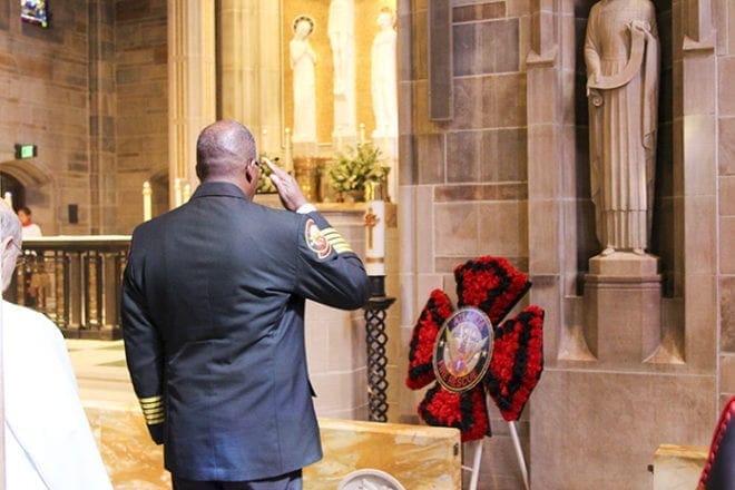 At the conclusion of the Blue Mass, Chief Joel G. Baker of the Atlanta Fire Rescue Department salutes before a memorial honoring those who died in the line of duty on Sept. 11, 2001, and within the Atlanta community. Photo By David Pace