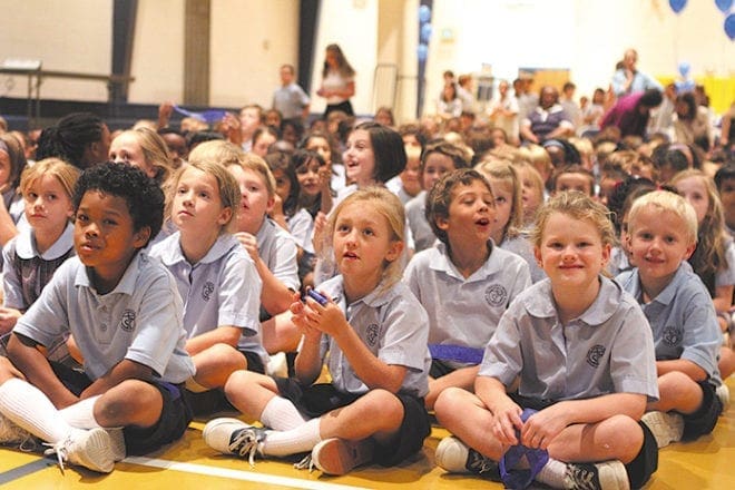 Students at St. Thomas More School, Decatur, prepare for the announcement Sept. 28 that their school has been named a National Blue Ribbon School of Excellence for the second time.