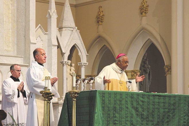 At the Green Mass, Archbishop Wilton D. Gregory, right, honored those who work in environmental sustainability and all who care for the earth. The Oct. 4 Mass was celebrated at the Shrine of the Immaculate Conception, Atlanta. Photo By David Pace