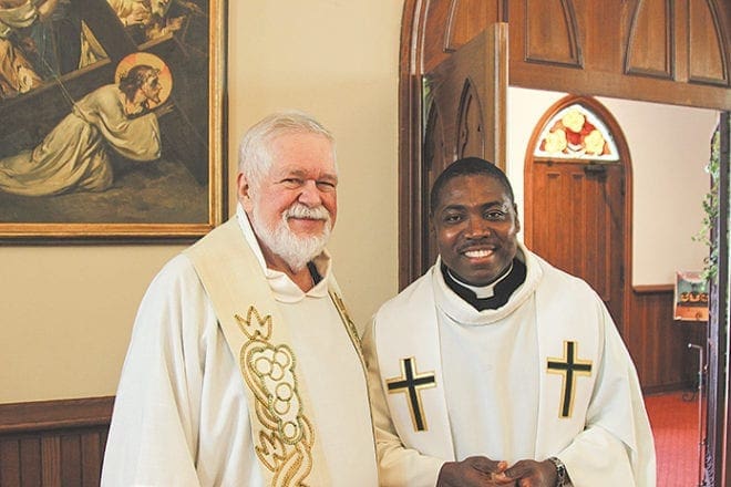 Msgr. Henry Gracz, pastor of the Shrine of the Immaculate Conception, and Father Urey Mark, SVD, campus minister at the Atlanta University Center and chaplain at Georgia State University, concelebrated the first Green Mass. Photo By David Pace