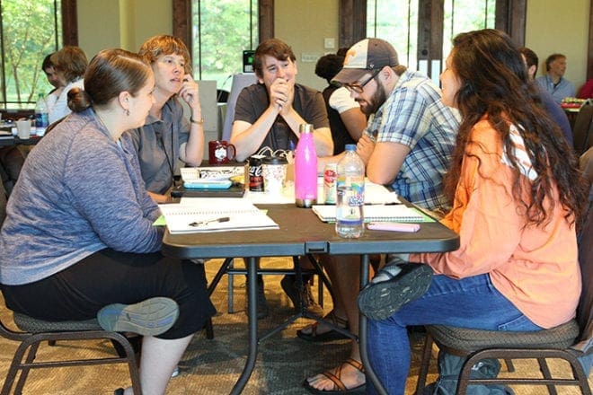 (Clockwise, from left) Sarah Taylor, youth minister at St. James Church, Conway, S.C., Cindy Caughman, youth minister at St. Thomas Aquinas Church, Alpharetta, David Burkemper, youth minister at St. Joseph Church, Tontitown, Ark., Jesse Butrum, youth minister at All Saints Church, Dunwoody, and Jessica Williams, middle school youth minister at St. Jude the Apostle Church, Sandy Springs, discuss a ministry-related topic during a morning session of the 2016 Institute for Catholic Youth Ministry. Photo By Michael Alexander