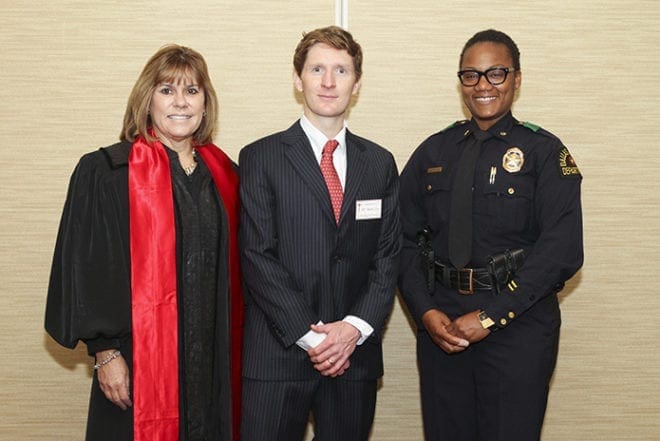 St. Thomas More Society president Jeff Adams, center, stands with St. Thomas More Award recipient, the Honorable Shawn Ellen LaGrua, Judge, Fulton County Superior Court, left, and Major LaToya Porter of the Dallas, Texas, Police Department, who was on hand to receive the St. Francis of Assisi Award on behalf of the city’s police department under retired police chief David O. Brown. Photo By Michael Alexander