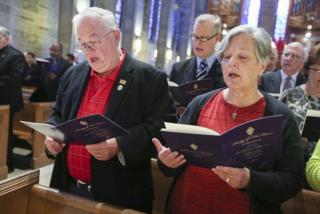 Deacon Bill Hampton and his wife, Kathy, of St. Matthew Church, Tyrone, are among the many people on hand for the evening of prayer for Bishop David Talley, the former auxiliary bishop of Atlanta and the recently named coadjutor bishop of Alexandria, La. Bishop Talley taught Deacon Hampton’s canon law class during his diaconate formation. Photo By Michael Alexander