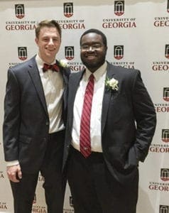 PHOTO BY MELINDA MARTIN Frank Martin ‘13 (left) and Aneek James ‘13 are shown prior to taking the field with the 2016 University of Georgia Homecoming Court. Both men are graduates of St. Pius X High School, Atlanta.