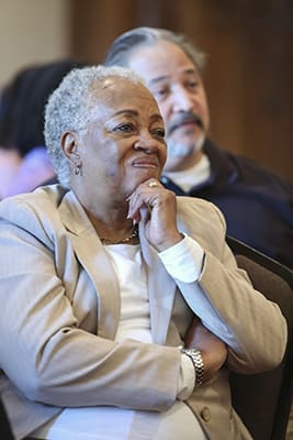 Marian Willingham, foreground, of Sts. Peter and Paul Church, Decatur, and Donald Perez, background, of Transfiguration Church, Marietta, listen to one of the morning speakers during "An Honest Look at Racism" program at the Cathedral of Christ the King, Atlanta, Nov. 5. Photo By Michael Alexander