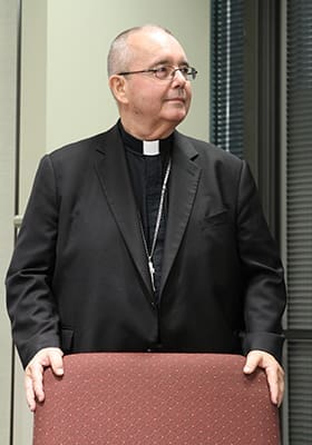 Bishop David Talley listens as Archbishop Wilton D. Gregory shares some words about him during an Oct. 19 farewell luncheon at the Archdiocese of Atlanta’s Chancery. Bishop Talley, who was an auxiliary bishop of Atlanta, was recently named coadjutor bishop of Alexandria, Louisiana. Photo By Michael Alexander