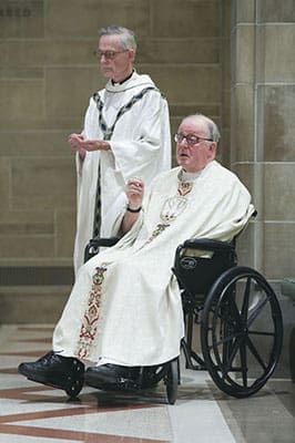 After Father Richard Kieran, right, had a stroke in 1999, his elder brother, Father John Kieran, 79, was always at his side during liturgical occasions around the Archdiocese of Atlanta. Both men were ordained in Ireland, but Father John was ordained two years after Father Richard. Photo By Michael Alexander