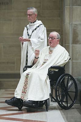 After Father Richard Kieran, right, had a stroke in 1999, his elder brother, Father John Kieran, 79, was always at his side during liturgical occasions around the Archdiocese of Atlanta. Both men were ordained in Ireland, but Father John was ordained two years after Father Richard. Photo By Michael Alexander