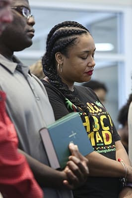 (R-l) Kristin Le Duff of Los Angeles and Sekou Remy of Clemson, S.C., returned to Atlanta for the Mass marking the 25th anniversary of Lyke House, the Catholic Center at the Atlanta University Center. Le Duff is a 2004 graduate of Clark Atlanta University. Remy is a 2002 graduate of Morehouse College and a 2009 graduate of Georgia Tech. Photo By Michael Alexander