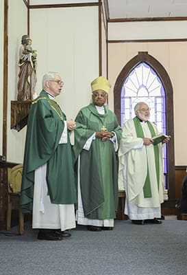 (L-r) Father Thomas Shuler, pastor of Our Lady of the Mount Church, Lookout Mountain, and administrator of St. Katharine Drexel Mission, Trenton, expresses his thanks to Archbishop Wilton D. Gregory, Msgr. Leo Herbert, the former pastor and original administrator, and the congregation. Photo By Michael Alexander