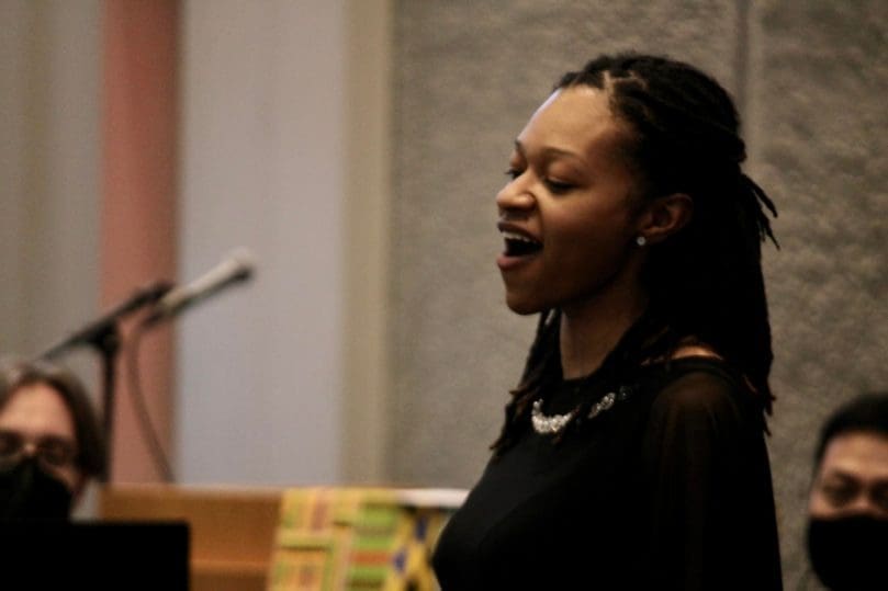 Singer sings a gospel song during a concert honoring Sister Thea Bowman.