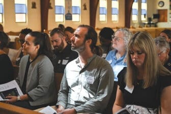 Man worshipping in Our Lady of Lourdes Church, Atlanta.